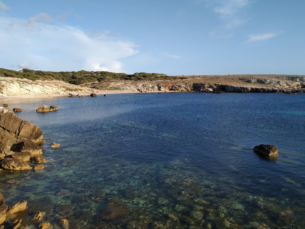 Cala Rotonda beach is less touristy.